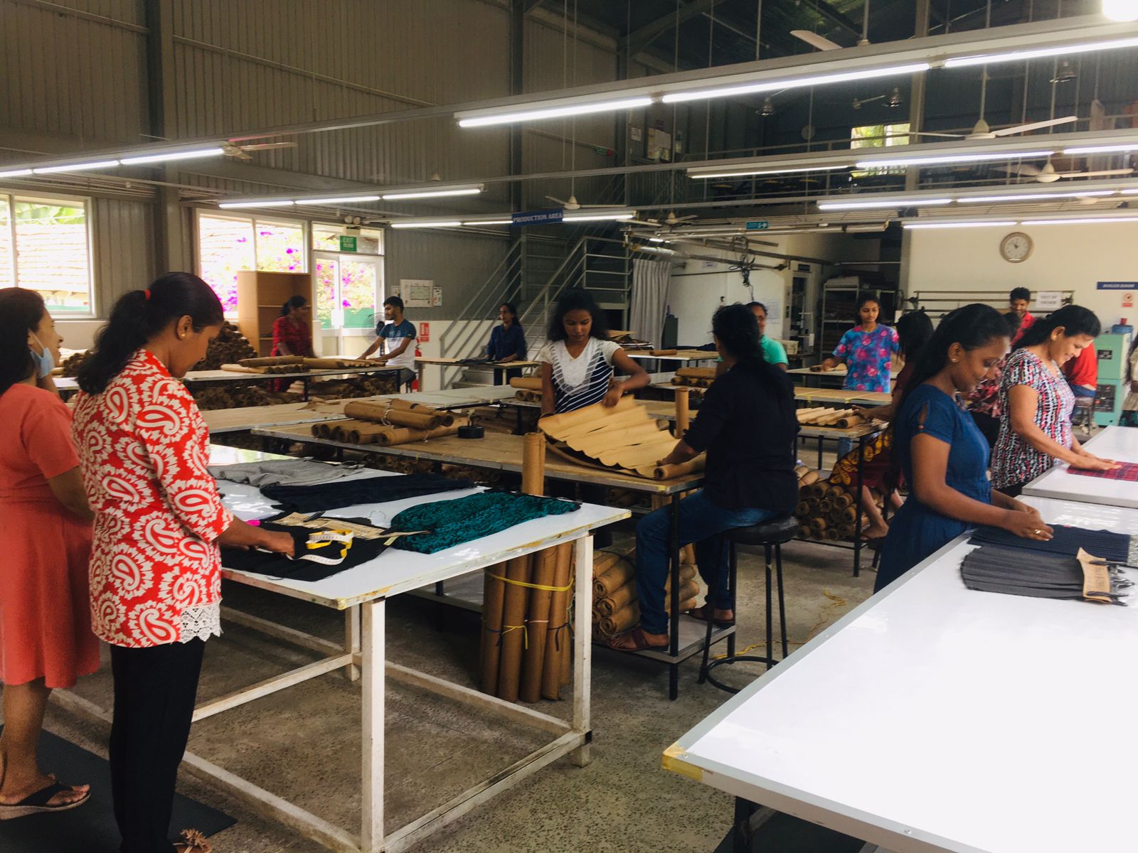 Quality Control Team Inspecting Pleated Fabrics